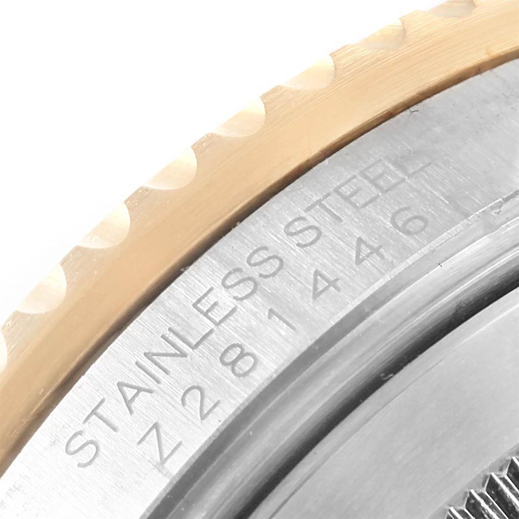 The image shows a close-up of the bezel and stainless steel case of a Rolex Submariner 16613 Men's Steel and Gold (two tone) Black Dial 16613 Men's Steel and Gold (two tone) Black Dial watch.