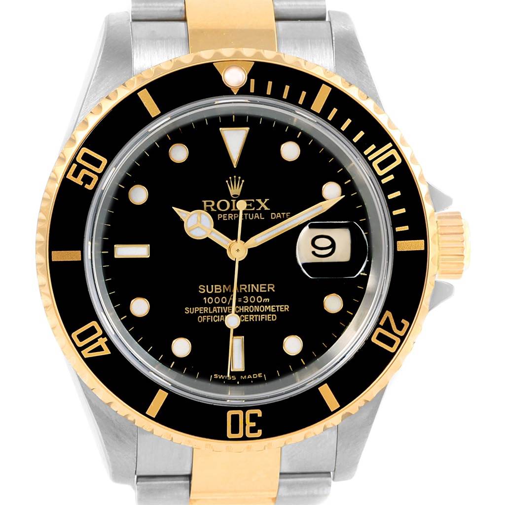 The image shows a frontal view of a Rolex Submariner 16613 Men's Steel and Gold (two tone) Black Dial 16613 Men's Steel and Gold (two tone) Black Dial watch, featuring its black dial, date window, and two-tone bezel and bracelet.