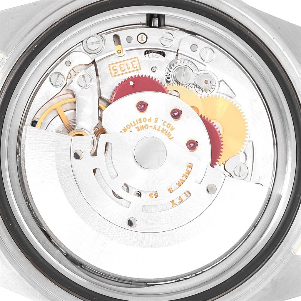 This image shows the inner mechanical movement parts of a Rolex Submariner 16613 Men's Steel and Gold (two tone) Black Dial 16613 Men's Steel and Gold (two tone) Black Dial watch, highlighting gears and components.