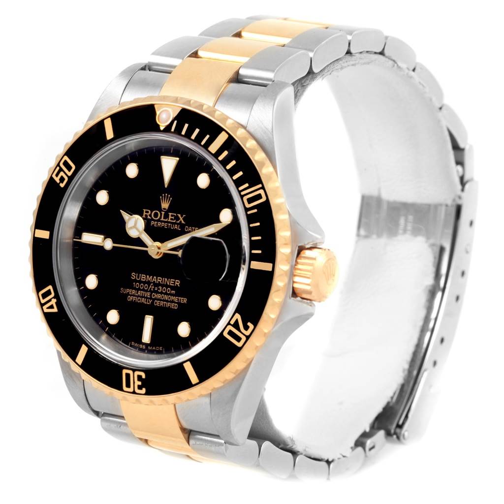 The image shows a Rolex Submariner 16613 Men's Steel and Gold (two tone) Black Dial 16613 Men's Steel and Gold (two tone) Black Dial watch at a three-quarter angle, highlighting its face, bezel, and two-tone bracelet.