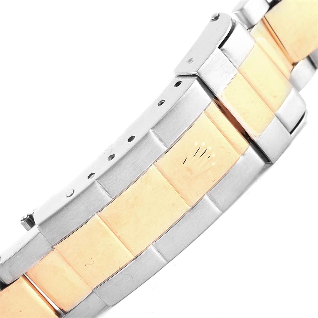 The image shows a close-up view of the bracelet of a Rolex Submariner 16613 Men's Steel and Gold (two tone) Black Dial 16613 Men's Steel and Gold (two tone) Black Dial watch, highlighting its two-tone design and clasp.