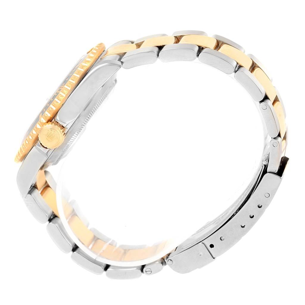 The image shows a side view of a Rolex Submariner 16613 Men's Steel and Gold (two tone) Black Dial 16613 Men's Steel and Gold (two tone) Black Dial watch, highlighting its crown, case, and bracelet.