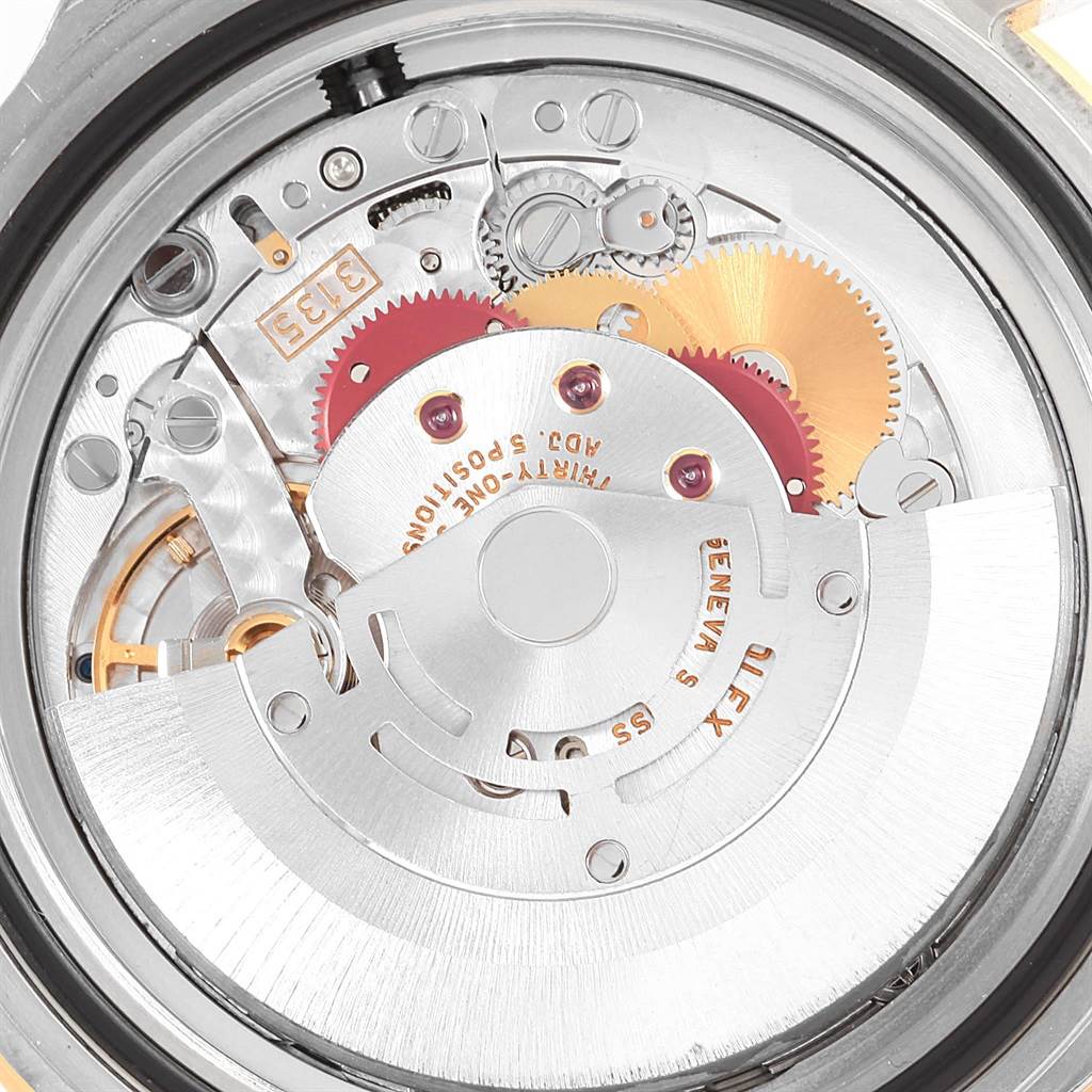 The image shows the internal mechanical movement parts of the Rolex Submariner 16613 Men's Steel and Gold (two tone) Black Dial 16613 Men's Steel and Gold (two tone) Black Dial watch from a rear angle.