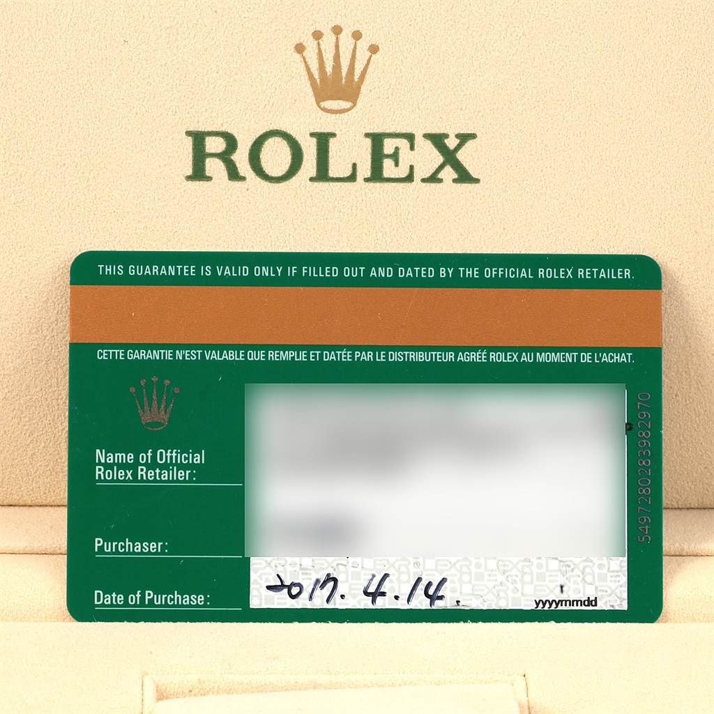 The image shows a Rolex warranty card for the Submariner model, with the Rolex logo and purchase details visible.