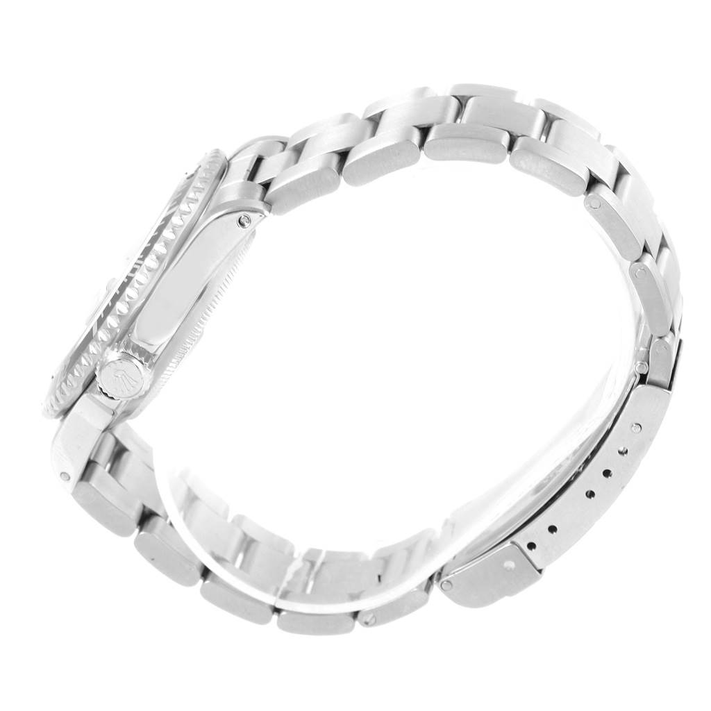 This side view of the Rolex Submariner 16610 Men's Stainless Steel Black Dial 16610 Men's Stainless Steel Black Dial watch shows its bracelet and clasp.