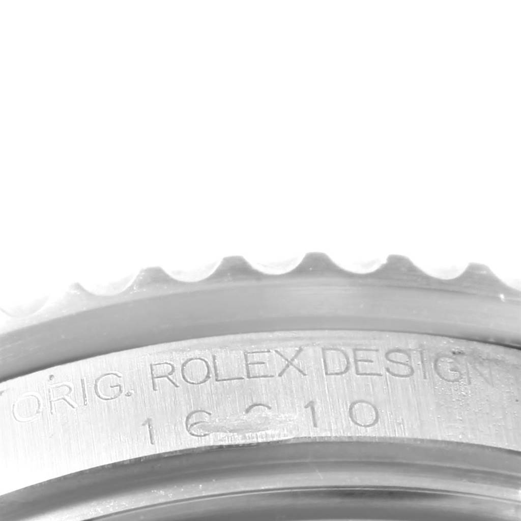 The image shows a close-up of the case side, focusing on the engraved bezel of the Rolex Submariner 16610 Men's Stainless Steel Black Dial 16610 Men's Stainless Steel Black Dial watch.