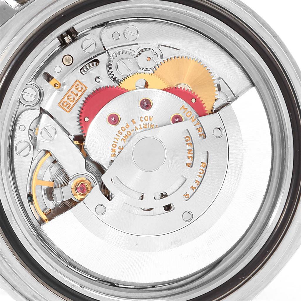 This image shows the intricate internal movement and mechanical gears of a Rolex Submariner 16610 Men's Stainless Steel Black Dial 16610 Men's Stainless Steel Black Dial watch.