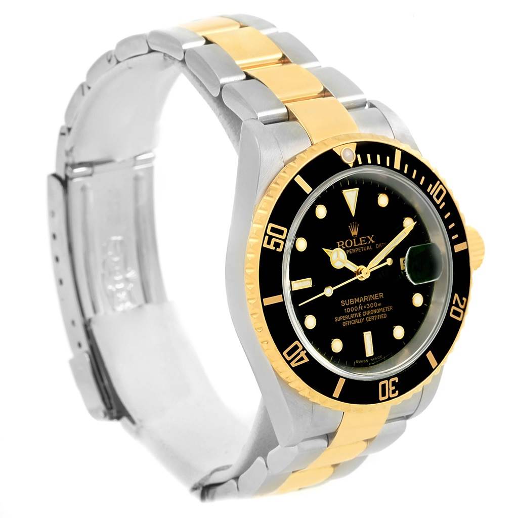 The image shows a Rolex Submariner 16613 Men's Steel and Gold (two tone) Black Dial 16613 Men's Steel and Gold (two tone) Black Dial watch at a slight angle, highlighting its black dial, gold bezel, and two-tone metal bracelet.