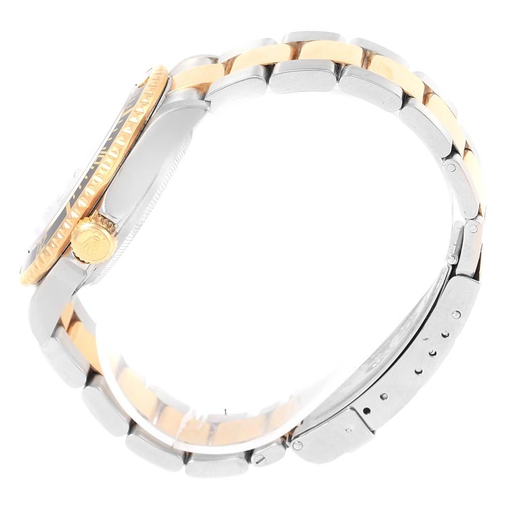 This image shows a side view of the Rolex Submariner 16613 Men's Steel and Gold (two tone) Black Dial 16613 Men's Steel and Gold (two tone) Black Dial watch, highlighting the crown, bezel, and two-tone bracelet.