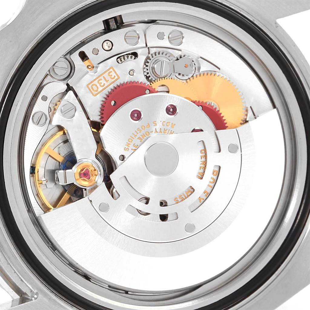 The image shows the internal movement mechanism of a Rolex Submariner 114060 Men's Stainless Steel Black Dial 114060 Men's Stainless Steel Black Dial watch from a rear angle, showcasing gears and components.