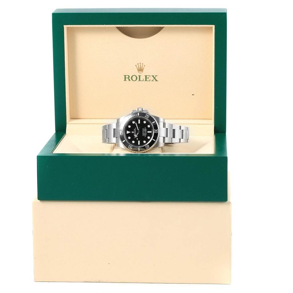 The Rolex Submariner 114060 Men's Stainless Steel Black Dial 114060 Men's Stainless Steel Black Dial is shown from the front, displayed in its green and beige branded box.