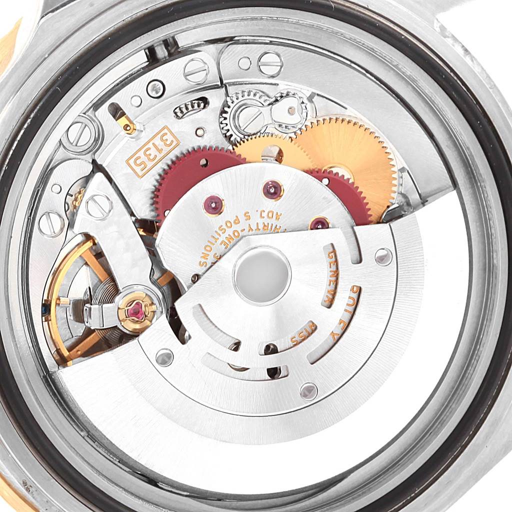 This image shows the internal mechanism of a Rolex Submariner 16613 Men's Steel and Gold (two tone) Blue Dial 16613 Men's Steel and Gold (two tone) Blue Dial watch from a rear angle.