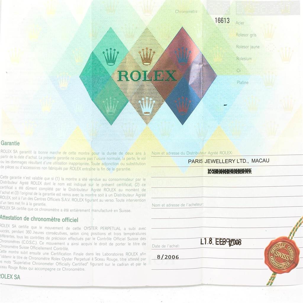 The image is of a warranty card for a Rolex Submariner 16613 Men's Steel and Gold (two tone) Blue Dial 16613 Men's Steel and Gold (two tone) Blue Dial watch, showing dealer details and purchase date.