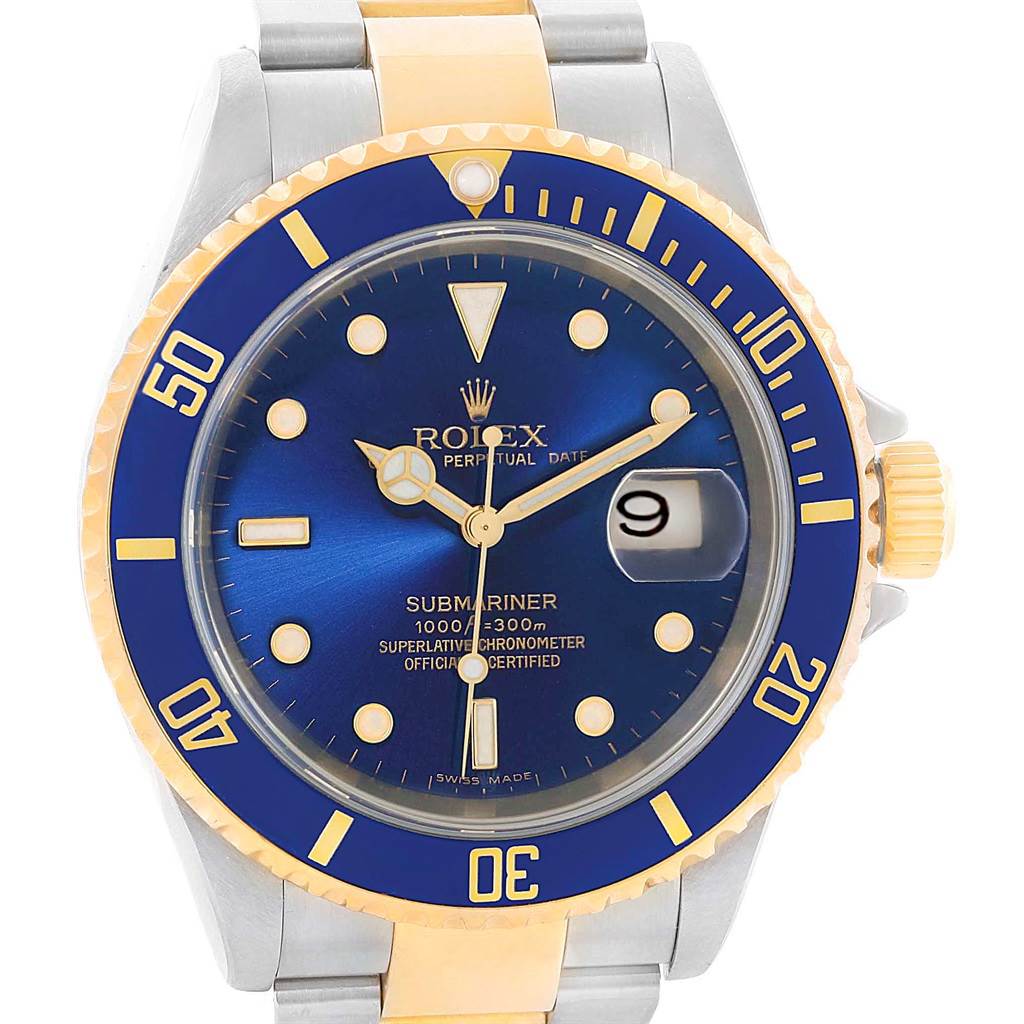 The image shows a front view of a Rolex Submariner 16613 Men's Steel and Gold (two tone) Blue Dial 16613 Men's Steel and Gold (two tone) Blue Dial watch with a blue dial and bezel, gold accents, and a date display at 3 o'clock.