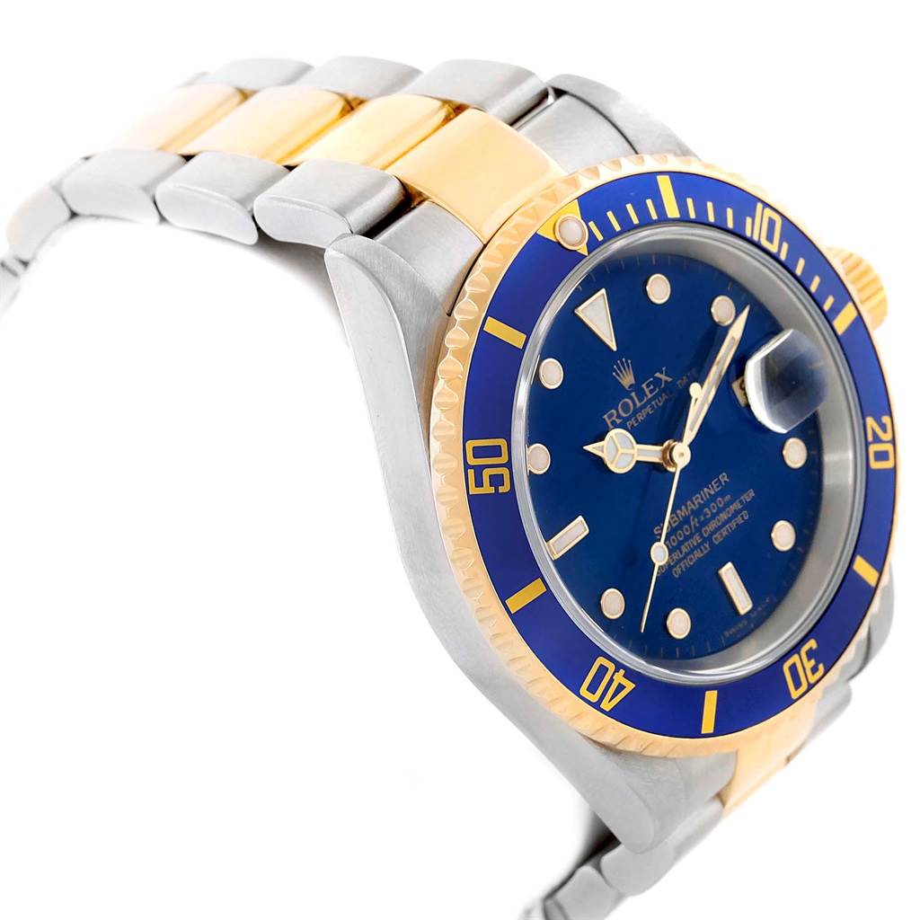 This image shows a side angle of a Rolex Submariner 16613 Men's Steel and Gold (two tone) Blue Dial 16613 Men's Steel and Gold (two tone) Blue Dial watch focusing on the blue and gold bezel, dial, and part of the bracelet.