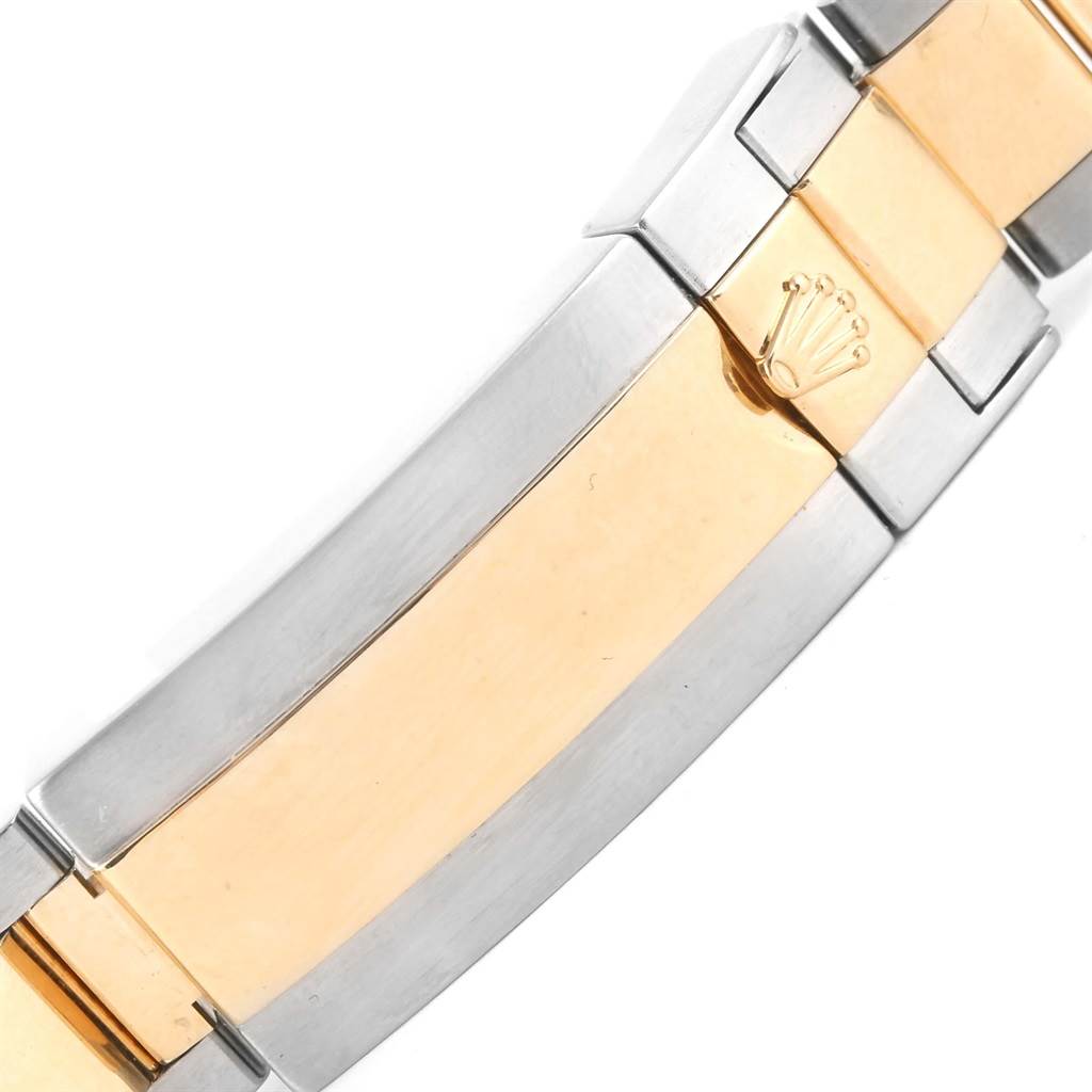 The image shows a close-up of the two-tone clasp of a Rolex Submariner 116613 Men's Steel and Gold (two tone) Black Dial 116613 Men's Steel and Gold (two tone) Black Dial watch.