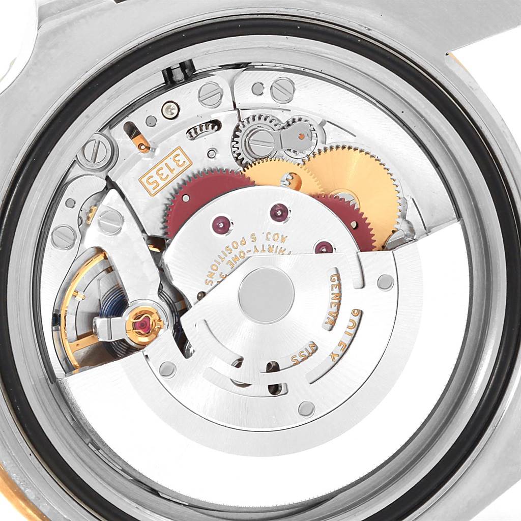 The image shows the back view of a Rolex Submariner 116613 Men's Steel and Gold (two tone) Black Dial 116613 Men's Steel and Gold (two tone) Black Dial's movement, highlighting its internal gears and mechanical components.
