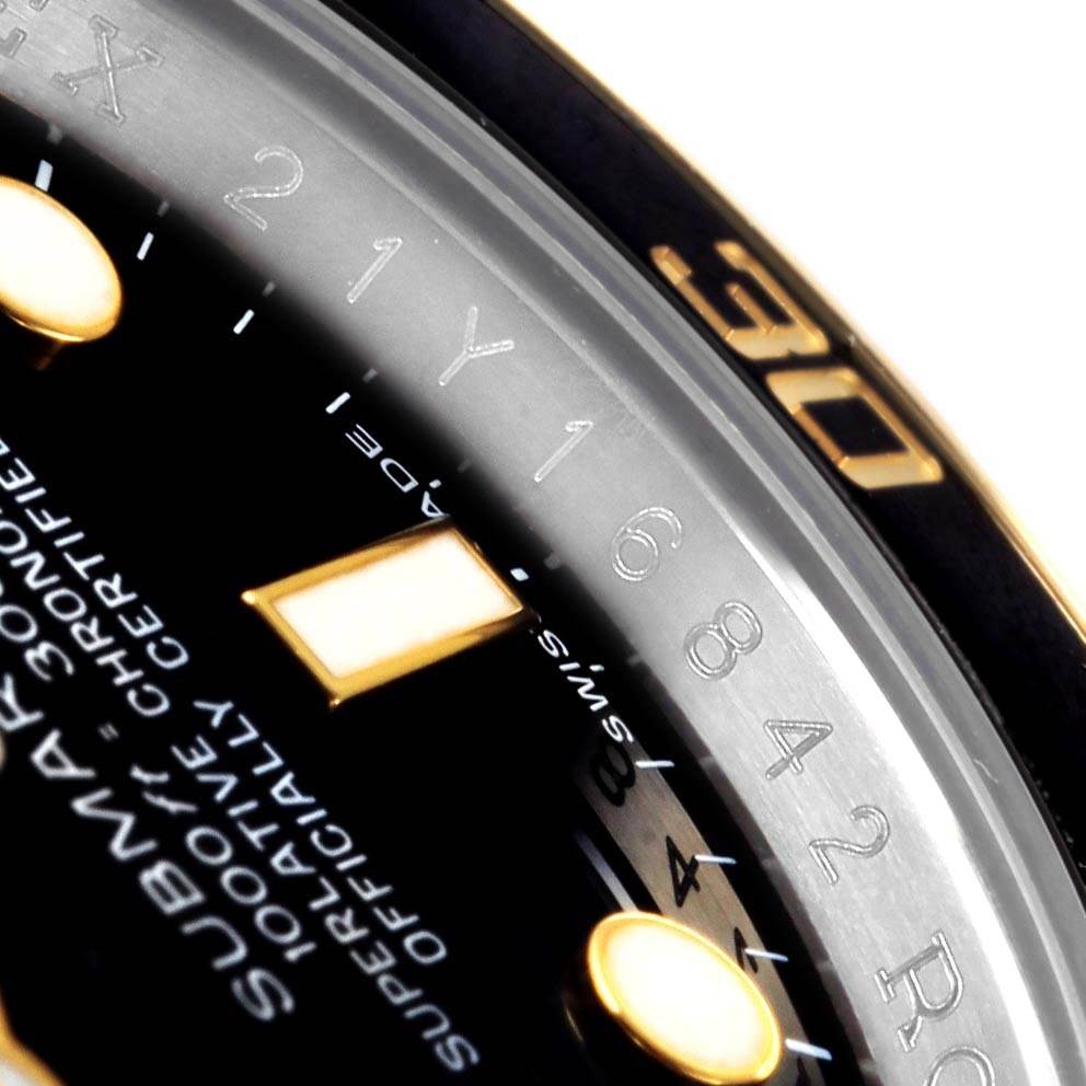 The image shows a close-up of the dial and bezel of a Rolex Submariner 116613 Men's Steel and Gold (two tone) Black Dial 116613 Men's Steel and Gold (two tone) Black Dial watch.