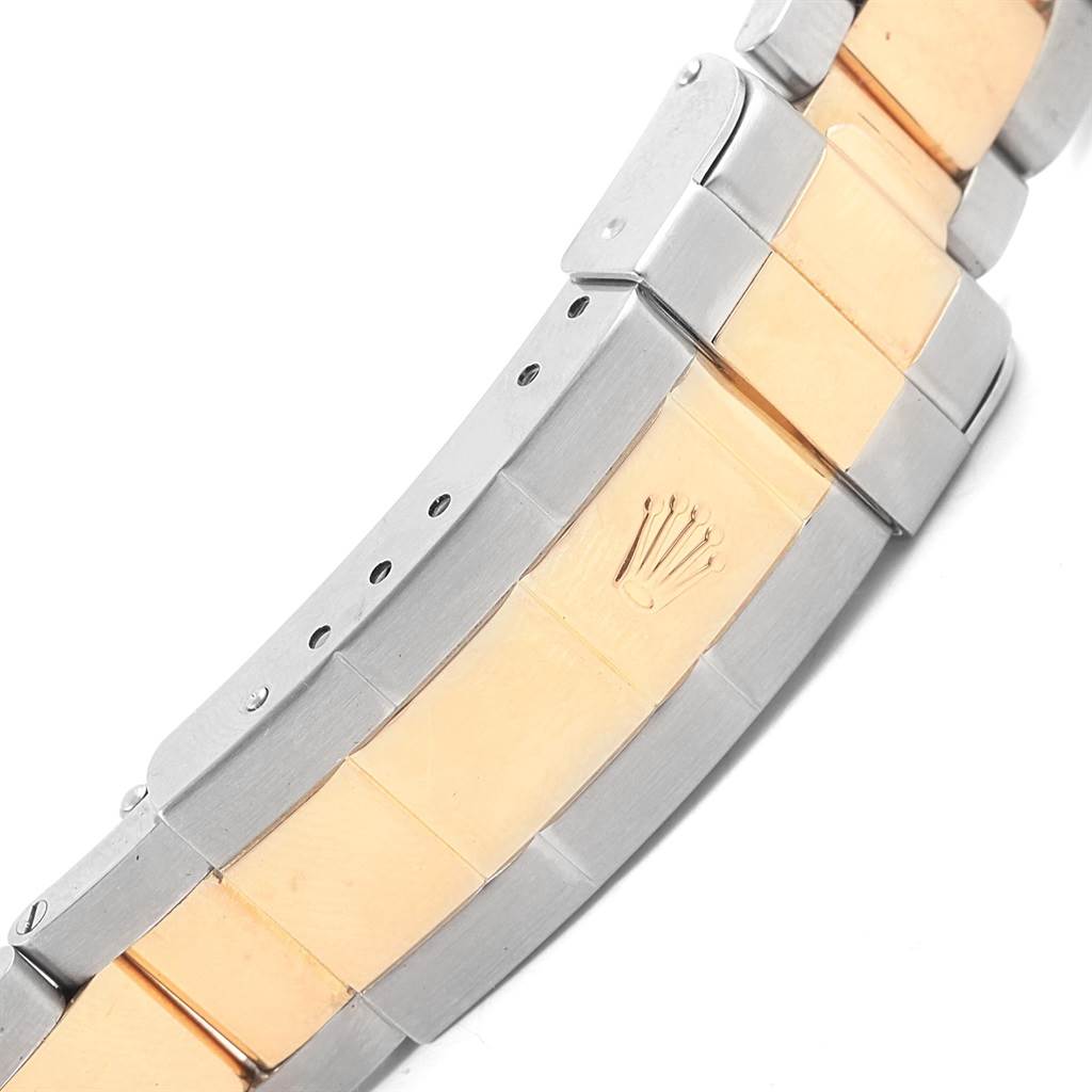 The image shows the two-tone bracelet and clasp of a Rolex Submariner 16613 Men's Steel and Gold (two tone) Blue Dial 16613 Men's Steel and Gold (two tone) Blue Dial watch, engraved with the Rolex crown logo.