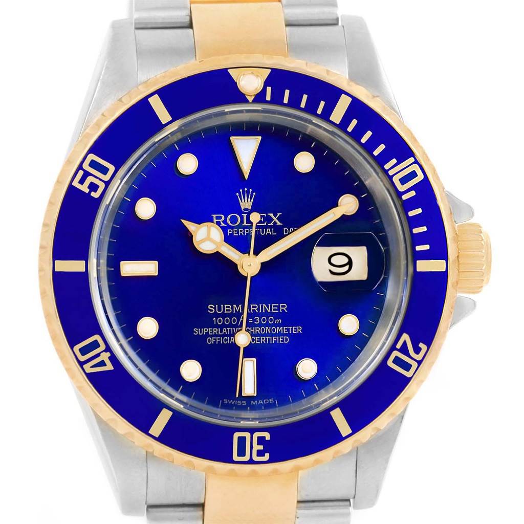 The image shows a front view of a Rolex Submariner 16613 Men's Steel and Gold (two tone) Blue Dial 16613 Men's Steel and Gold (two tone) Blue Dial watch with a blue dial, gold bezel, and date display.