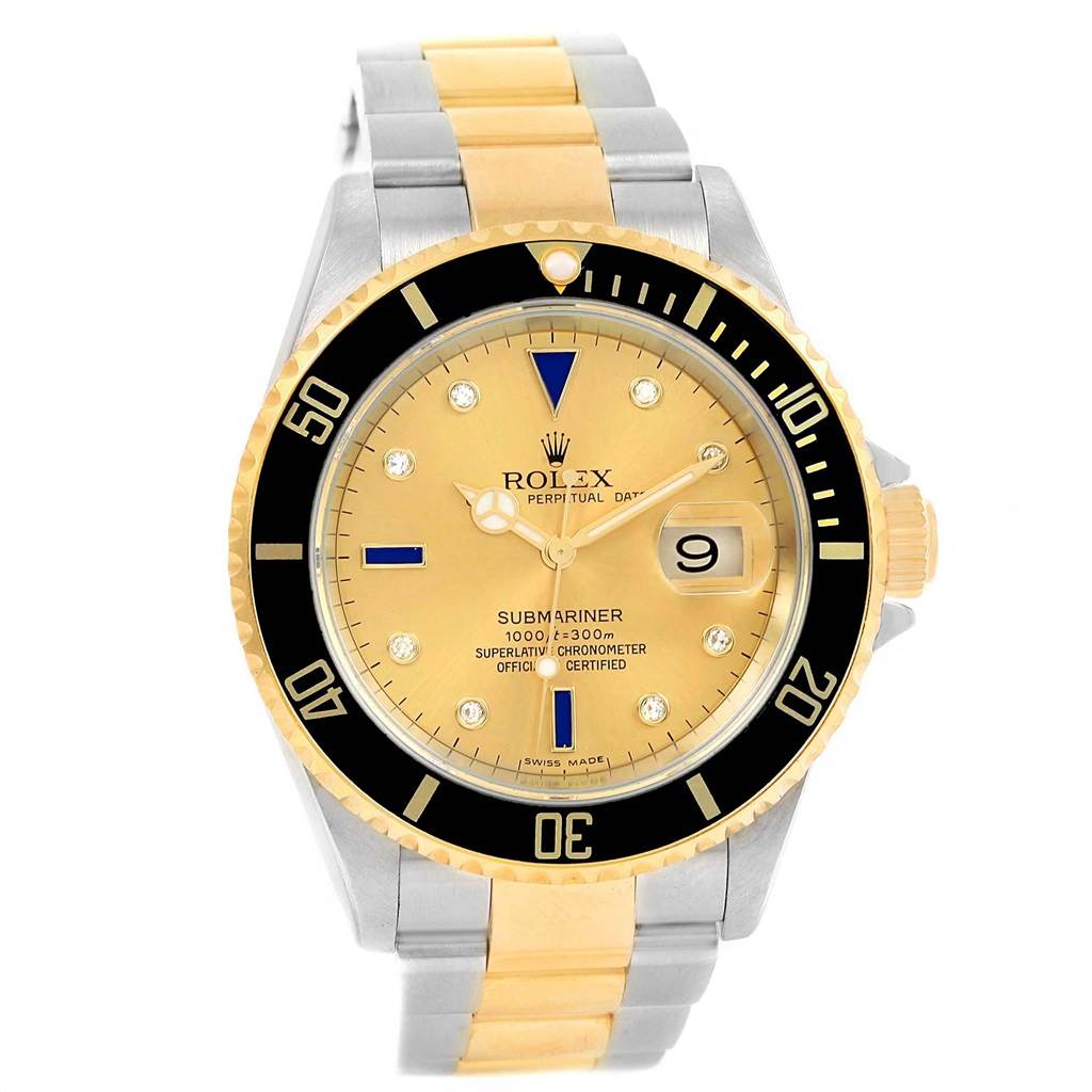 The image shows a frontal view of a Rolex Submariner 16613 Men's Steel and Gold (two tone) Champagne Dial 16613 Men's Steel and Gold (two tone) Champagne Dial with a two-tone gold and silver bracelet and a gold bezel and dial.