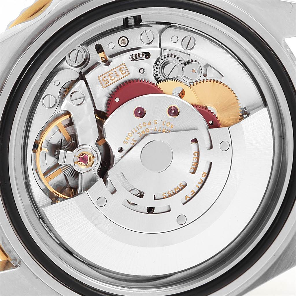 This image shows the internal mechanism and movement of the Rolex Submariner 16613 Men's Steel and Gold (two tone) Blue Dial 16613 Men's Steel and Gold (two tone) Blue Dial watch from a rear angle.