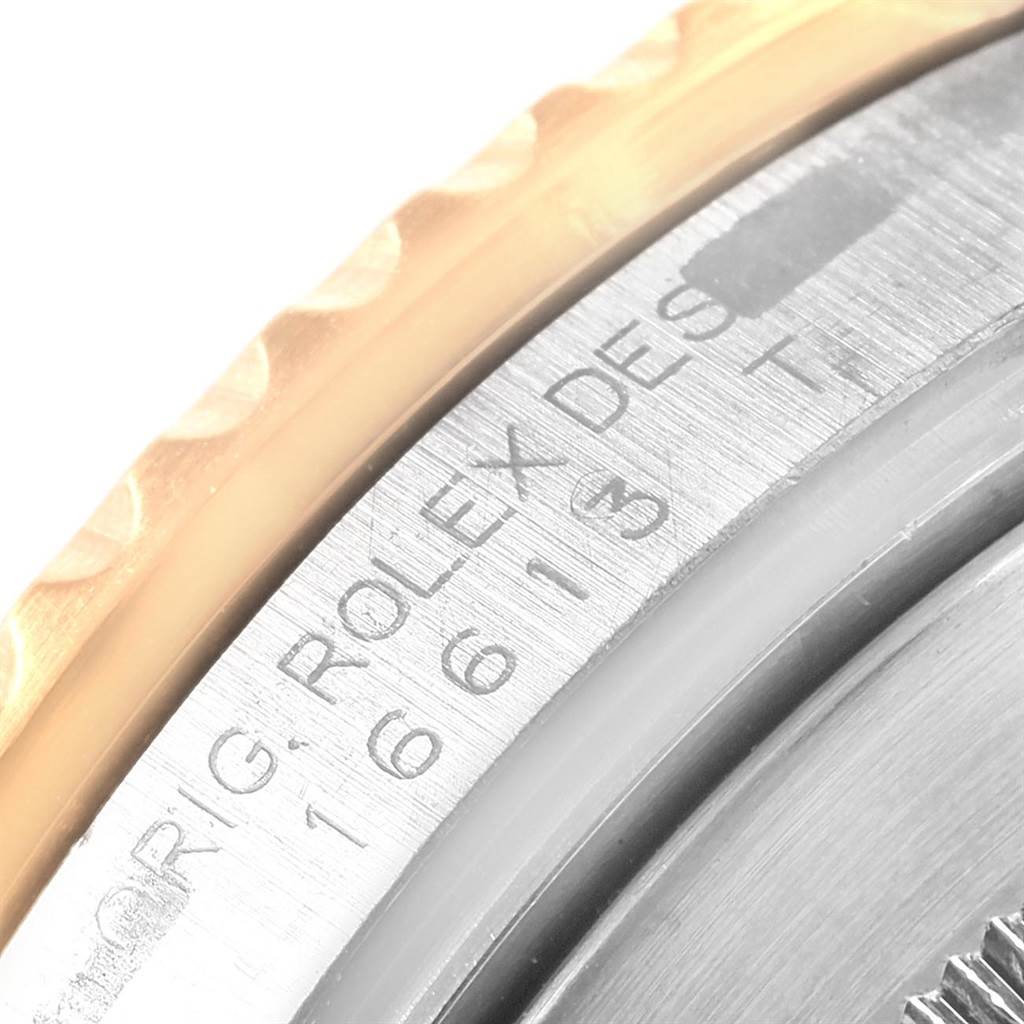 The image shows a close-up of the model number engraving on the side of the bezel of a Rolex Submariner 16613 Men's Steel and Gold (two tone) Blue Dial 16613 Men's Steel and Gold (two tone) Blue Dial watch.