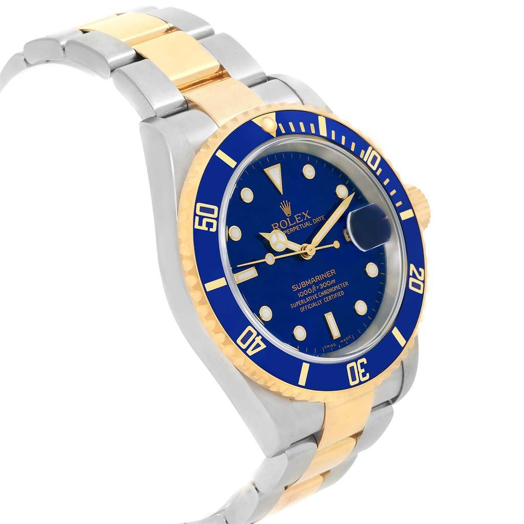 The image shows a side angle of a Rolex Submariner 16613 Men's Steel and Gold (two tone) Blue Dial 16613 Men's Steel and Gold (two tone) Blue Dial watch focusing on its blue dial, bezel, and two-tone metal bracelet.