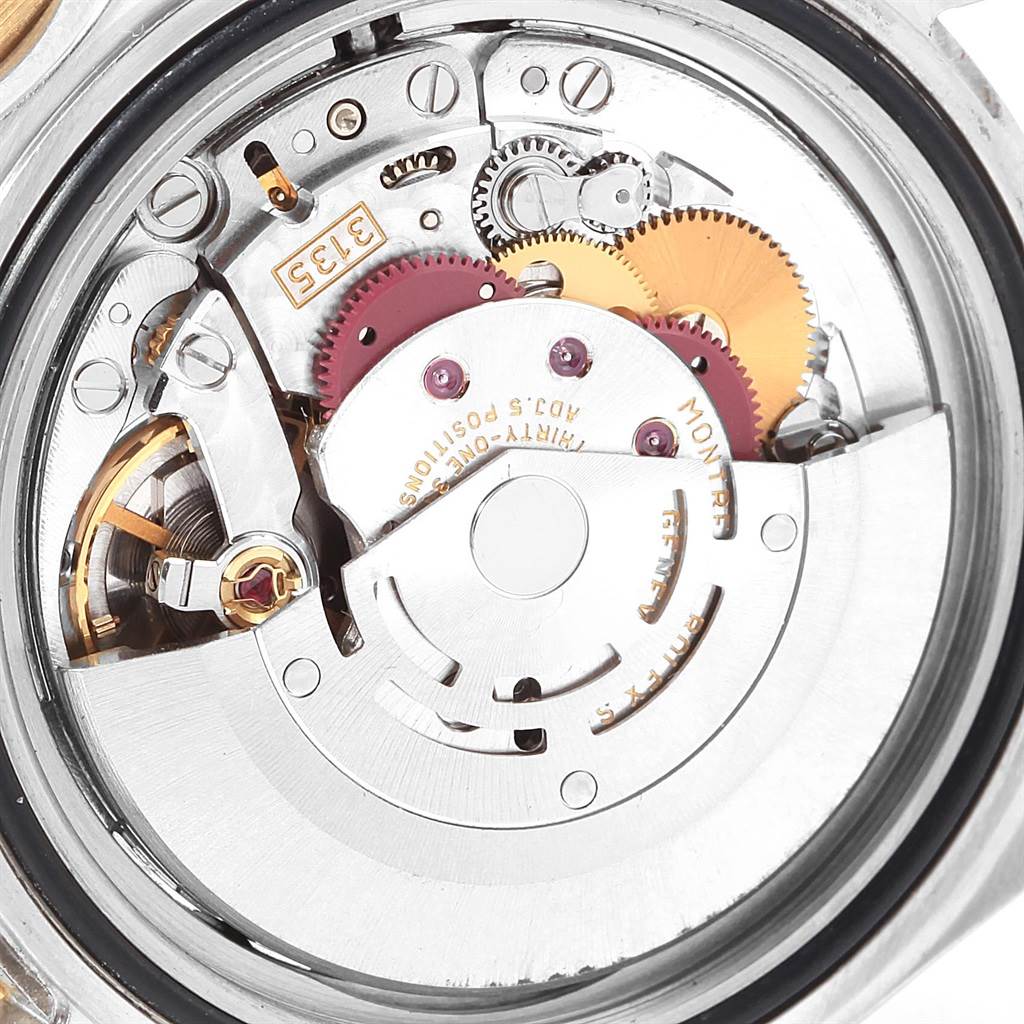 This image shows the internal mechanism of a Rolex Submariner 16613 Men's Steel and Gold (two tone) Blue Dial 16613 Men's Steel and Gold (two tone) Blue Dial watch, viewed from the back.