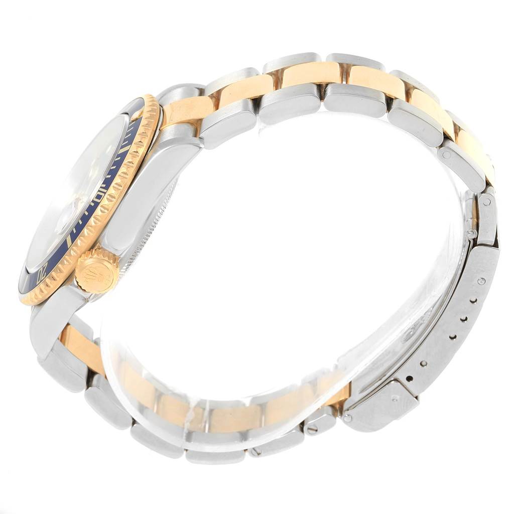 This image shows a side view of the Rolex Submariner 16613 Men's Steel and Gold (two tone) Blue Dial 16613 Men's Steel and Gold (two tone) Blue Dial watch, highlighting the bracelet, clasp, and partial bezel.