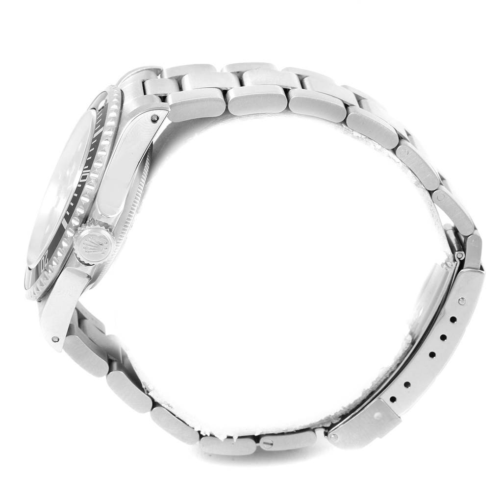 The Rolex Submariner 14060 Men's Stainless Steel Black Dial 14060 Men's Stainless Steel Black Dial watch is shown from a side view, displaying the case, bezel, crown, and metal bracelet.