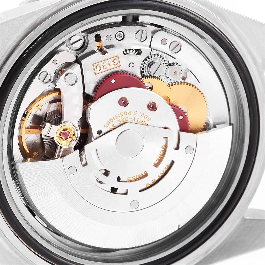 This image shows a detailed close-up of the movement mechanism inside a Rolex Submariner 14060 Men's Stainless Steel Black Dial 14060 Men's Stainless Steel Black Dial watch.