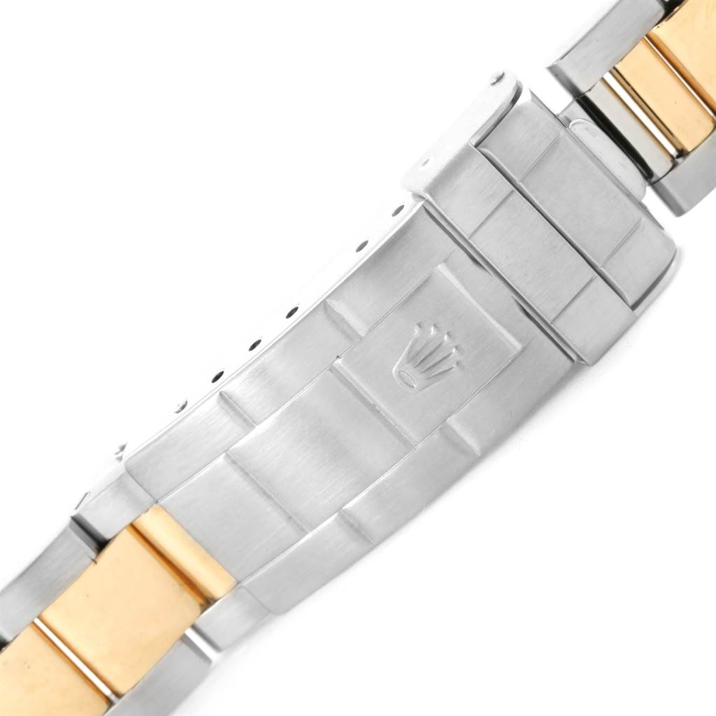 The image shows the clasp and part of the bracelet of a Rolex Submariner 16613 Men's Steel and Gold (two tone) Blue Dial 16613 Men's Steel and Gold (two tone) Blue Dial watch.