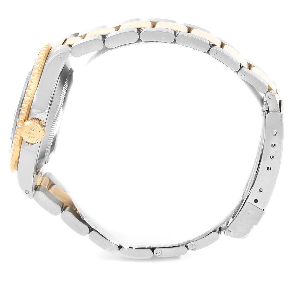 This image shows a side view of the Rolex Submariner 16613 Men's Steel and Gold (two tone) Blue Dial 16613 Men's Steel and Gold (two tone) Blue Dial watch, highlighting its crown, case, and bracelet.