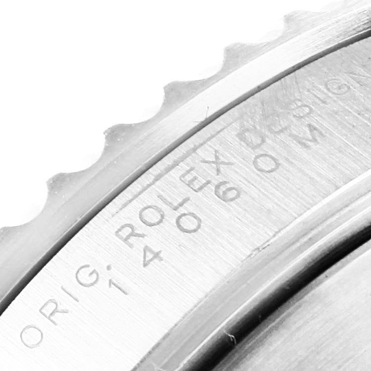 This image shows a close-up of the case back edge with engravings of a Rolex Submariner 14060 Men's Stainless Steel Black Dial 14060 Men's Stainless Steel Black Dial watch.