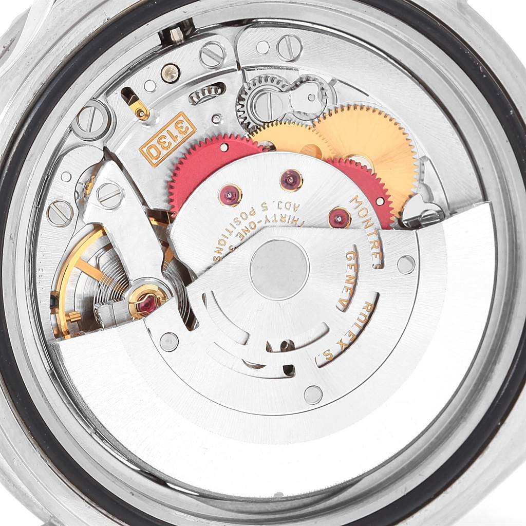 The image shows the intricate inner mechanism and movement parts of a Rolex Submariner 14060 Men's Stainless Steel Black Dial 14060 Men's Stainless Steel Black Dial watch from a back angle.