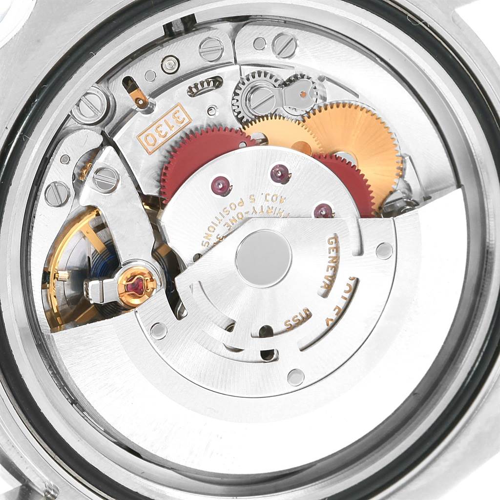 The image shows the movement of a Rolex Submariner 114060 Men's Stainless Steel Black Dial 114060 Men's Stainless Steel Black Dial watch from a back view, highlighting the intricate gears and components.