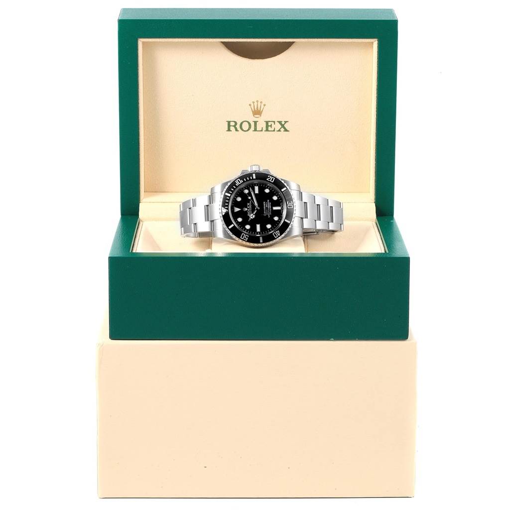 This image shows a Rolex Submariner 114060 Men's Stainless Steel Black Dial 114060 Men's Stainless Steel Black Dial watch from a front angle, displayed in a green and cream-colored Rolex box.