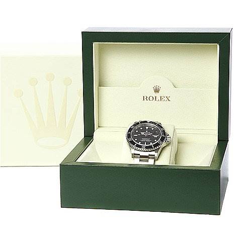 The Rolex Submariner 16610 Men's Stainless Steel Black Dial 16610 Men's Stainless Steel Black Dial watch is displayed inside an open green and white Rolex box, viewed from a front angle.