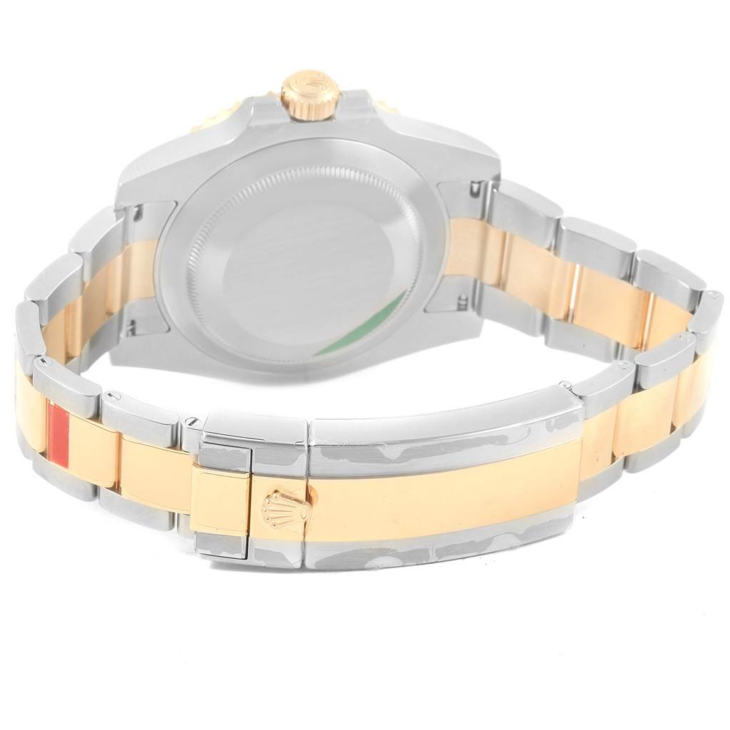 The image shows the back of a Rolex Submariner 116613 Men's Steel and Gold (two tone) Blue Dial 116613 Men's Steel and Gold (two tone) Blue Dial watch, highlighting the case back, crown, and two-tone bracelet.