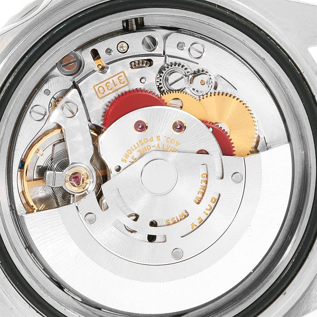 This image shows a close-up of the movement mechanism inside a Rolex Submariner 14060 Men's Stainless Steel Black Dial 14060 Men's Stainless Steel Black Dial watch.