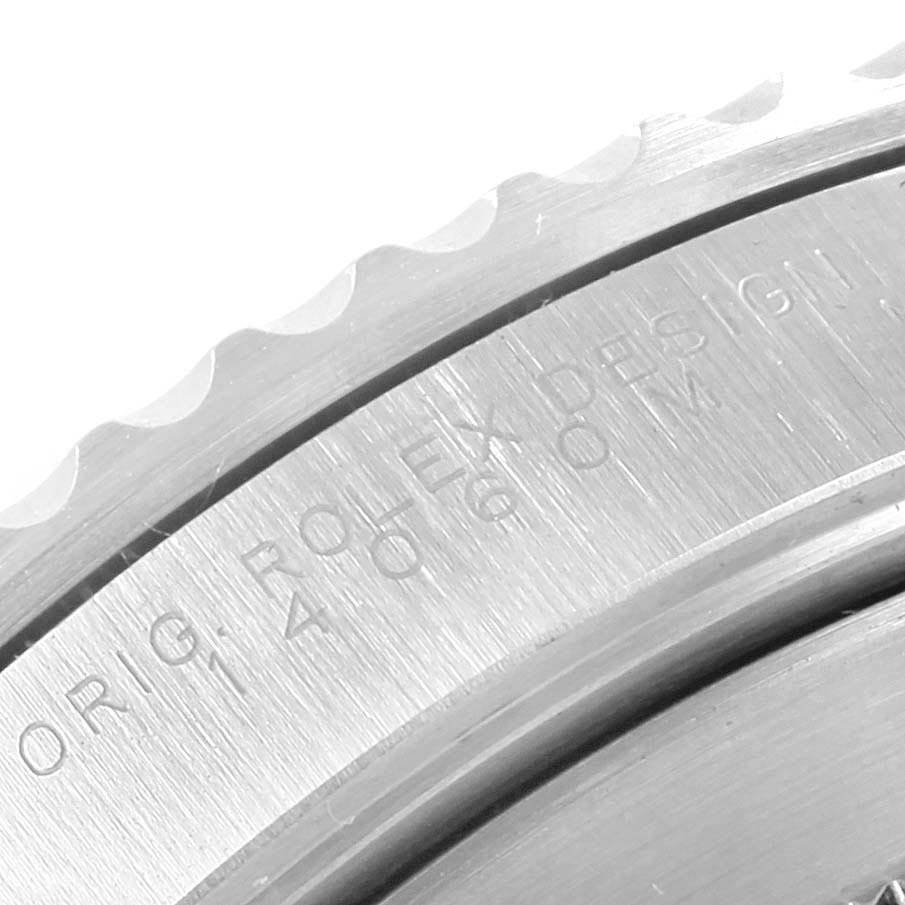 The image shows a close-up of the engraved bezel and case back of a Rolex Submariner 14060 Men's Stainless Steel Black Dial 14060 Men's Stainless Steel Black Dial watch.