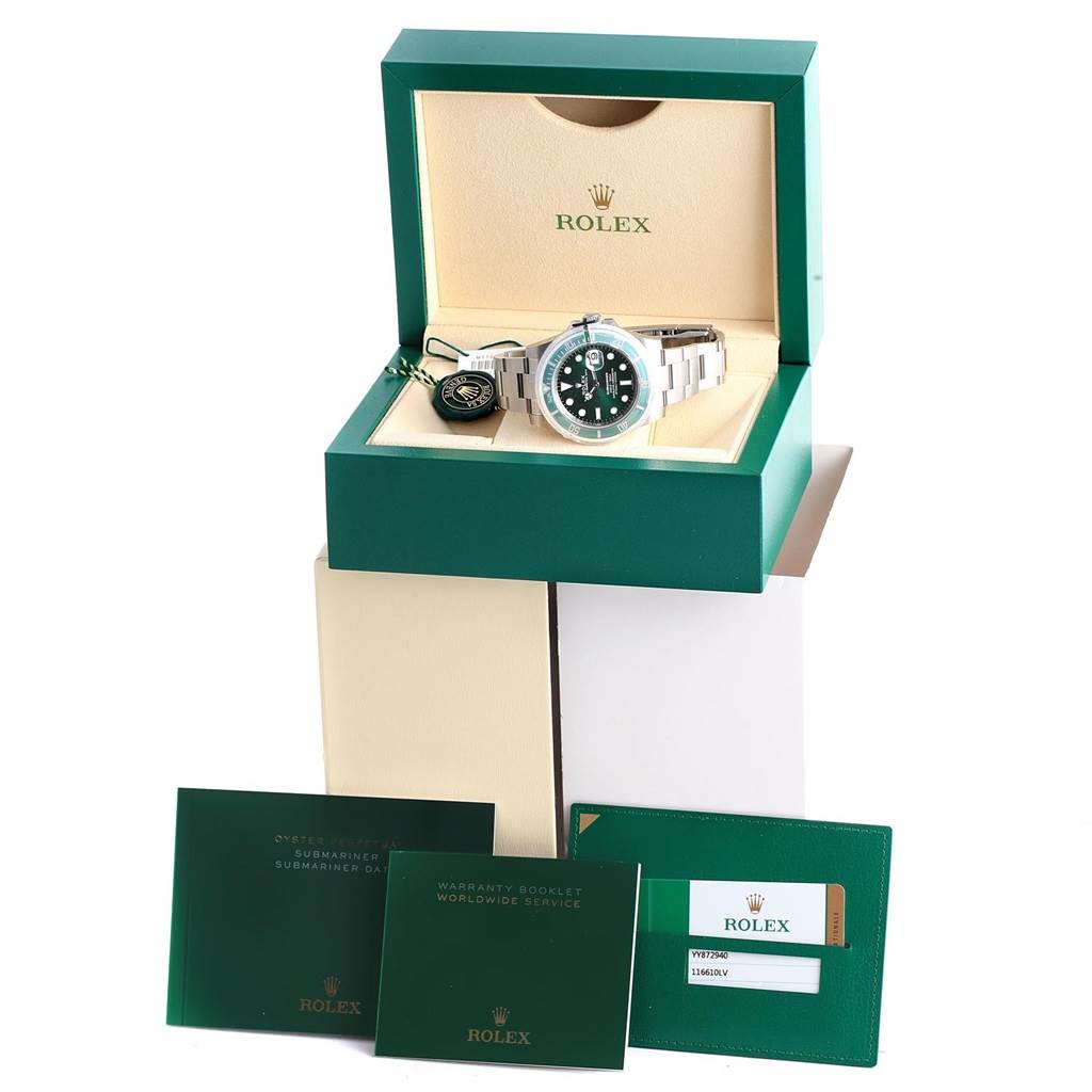 The image shows a Rolex Submariner 116610LV Men's Stainless Steel Green Dial 116610LV Men's Stainless Steel Green Dial watch in its open box with warranty card, booklet, and tag visible.