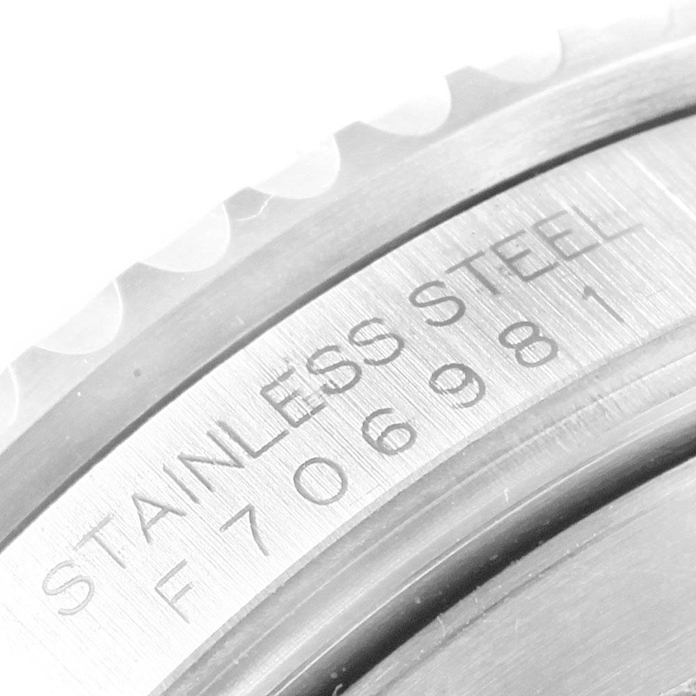 This close-up image shows the stainless steel case back engraving of the Rolex Submariner 16610LV Men's Stainless Steel Black Dial 16610LV Men's Stainless Steel Black Dial watch.