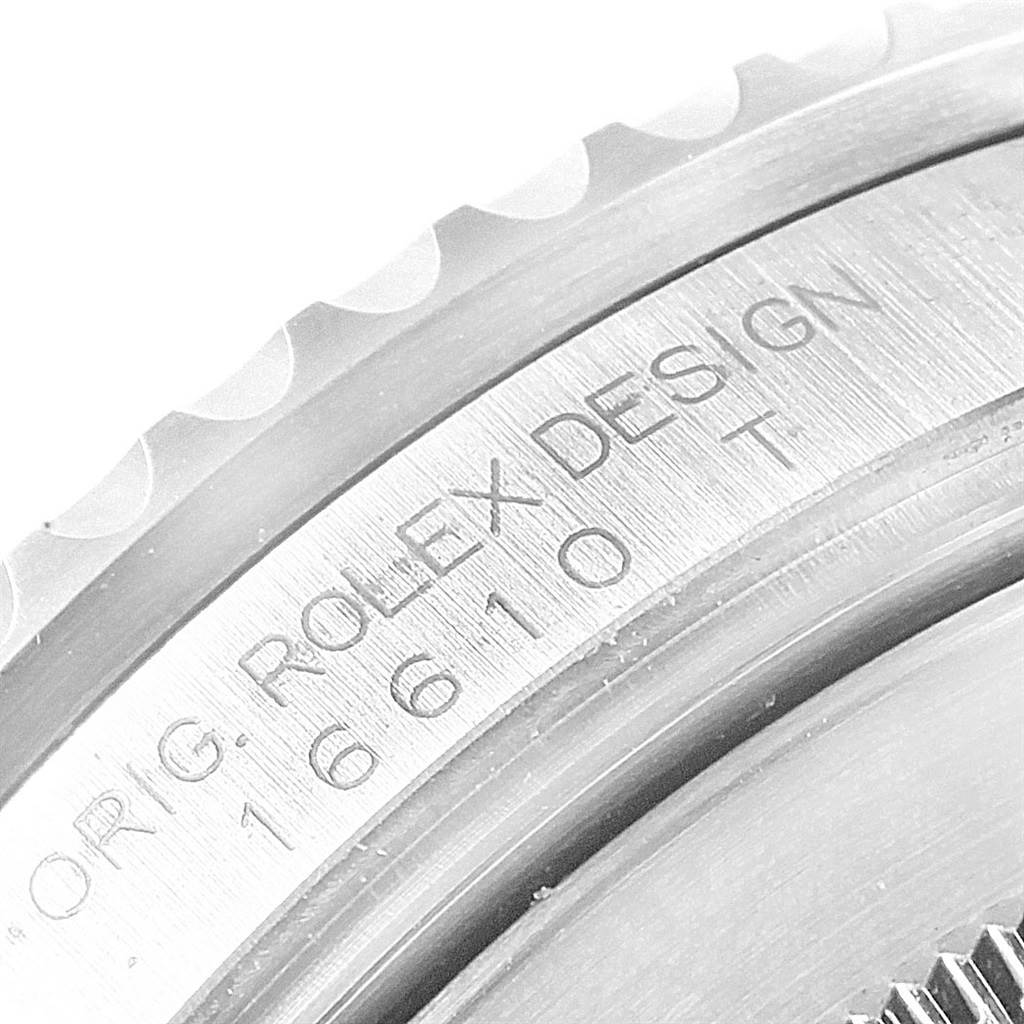 The image shows a close-up of the engraved bezel edge of a Rolex Submariner 16610LV Men's Stainless Steel Black Dial 16610LV Men's Stainless Steel Black Dial, featuring model details.