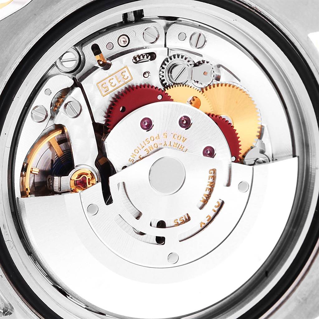 This image shows the movement mechanism of a Rolex Submariner 116613 Men's Steel and Gold (two tone) Black Dial 116613 Men's Steel and Gold (two tone) Black Dial watch from the back.