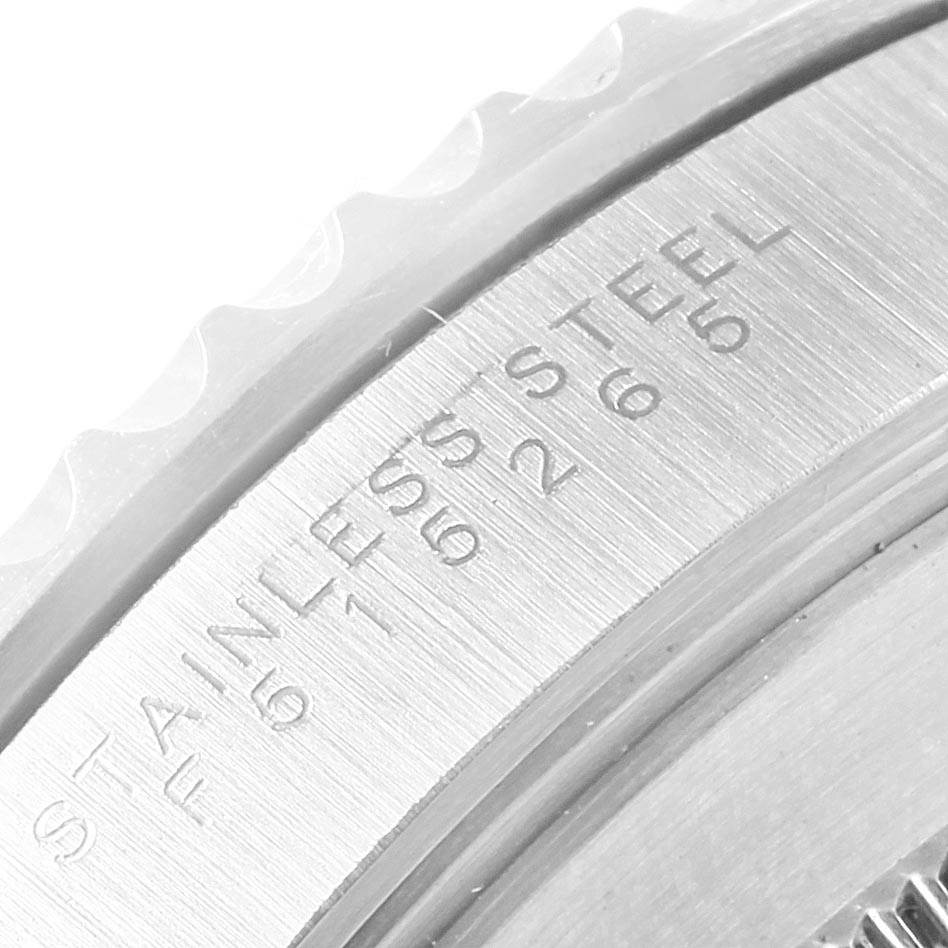 This image shows a close-up of the case back and bezel edge of a Rolex Submariner 14060 Men's Stainless Steel Black Dial 14060 Men's Stainless Steel Black Dial watch, highlighting the "STAINLESS STEEL" engraving.