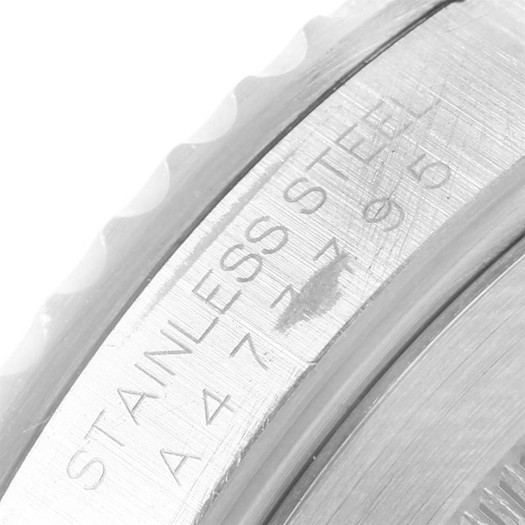 This close-up image shows the side engraving of the stainless steel case of a Rolex Submariner 14060 Men's Stainless Steel Black Dial 14060 Men's Stainless Steel Black Dial watch.