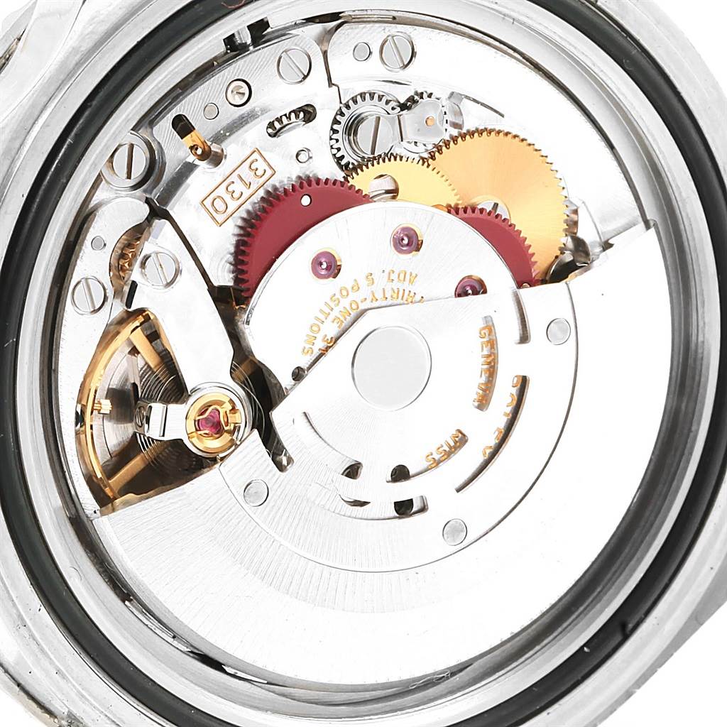 This image shows a close-up view of the internal movement components of a Rolex Submariner 14060 Men
s Stainless Steel Black Dial 14060 Men
s Stainless Steel Black Dial watch.