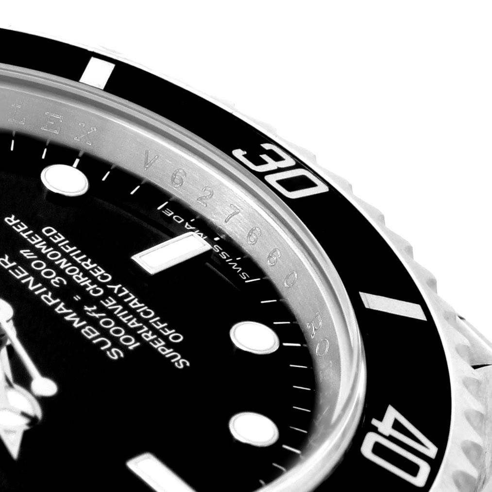This close-up image shows the bezel and part of the dial of a Rolex Submariner 14060 Men
s Stainless Steel Black Dial 14060 Men
s Stainless Steel Black Dial watch.